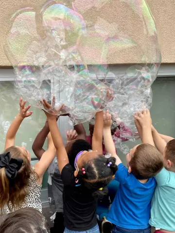 Children playing with bubbles