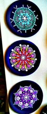 Three circular mandala dot paintings