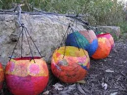Colorful paper lanterns on rock wall
