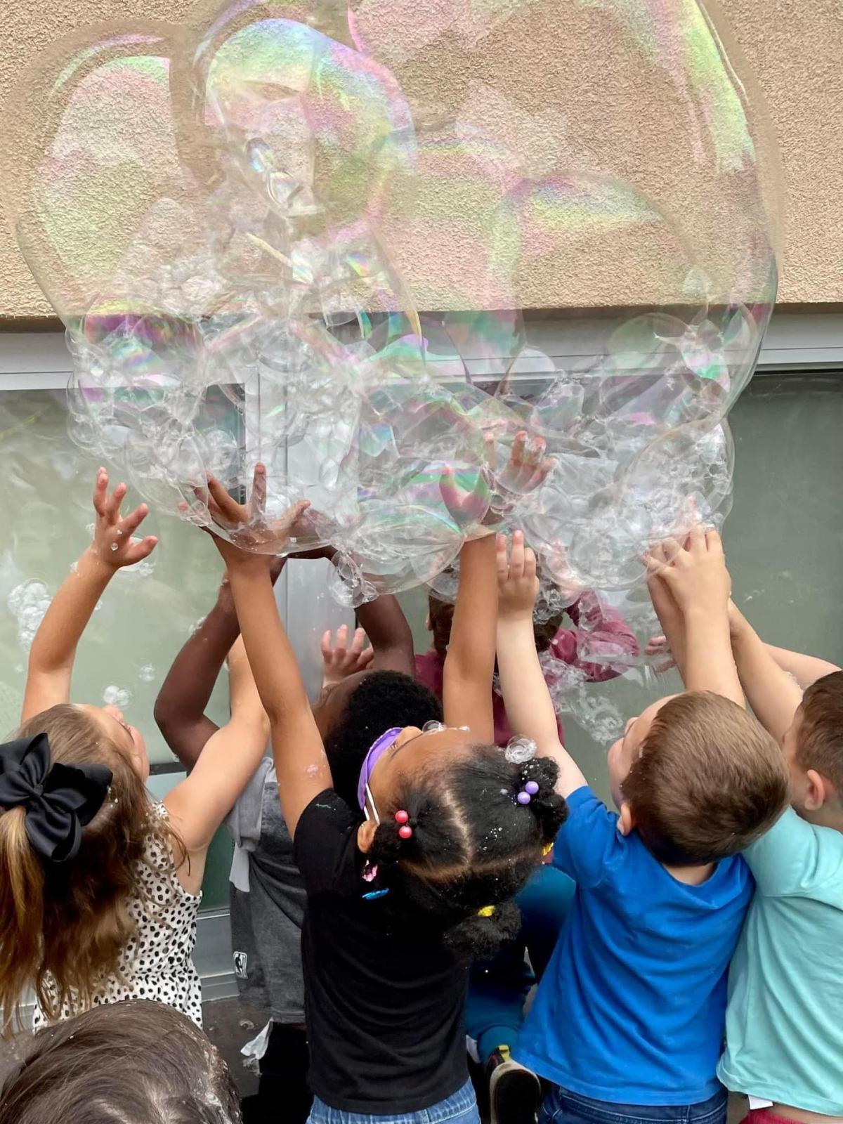 Children playing with bubbles