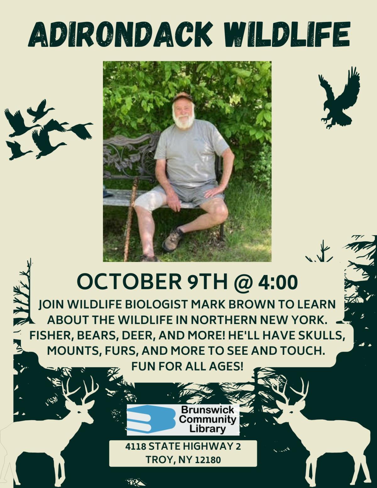 Flyer shows image of male presenter sitting on a bench in the woods.